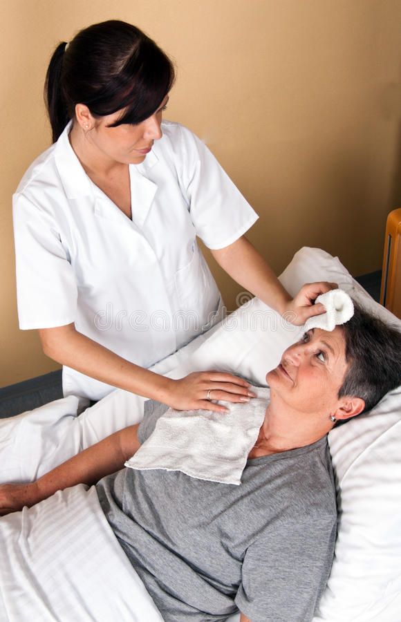 Nurses wash a patient stock image_ Image of retirement - 14182791